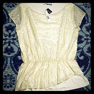 Off-white and gold lace peplum top.