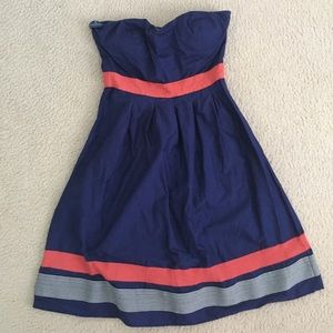 Strapless navy blue and coral thigh length dress.