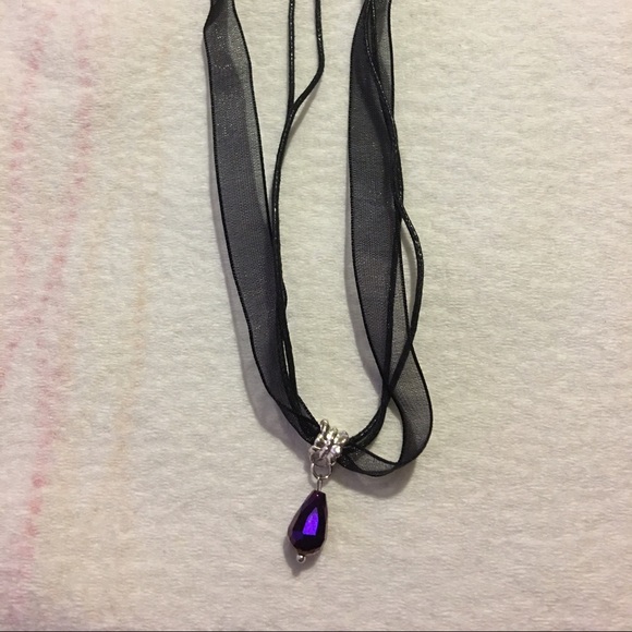 Necklace with purple pendant