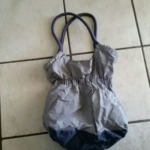 A blue and white striped shoulder bag