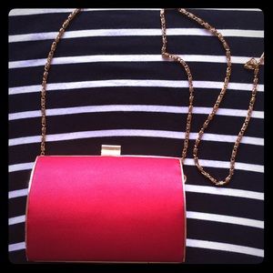 Red clutch with gold hardware