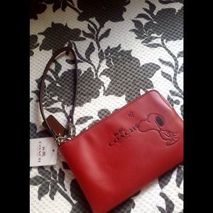 Coach Snoopy limited edition zip wristlet.