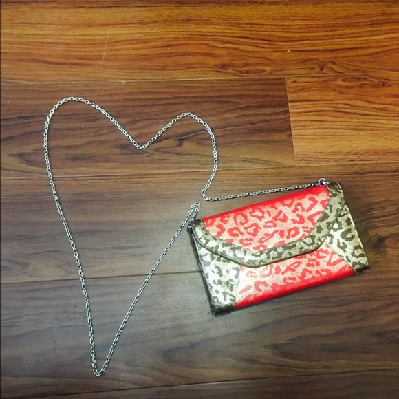 A leopard red and gold bag