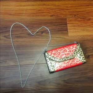 A leopard red and gold bag