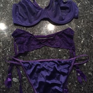 Cacique purple see-thru bra, shiny panty,garter.