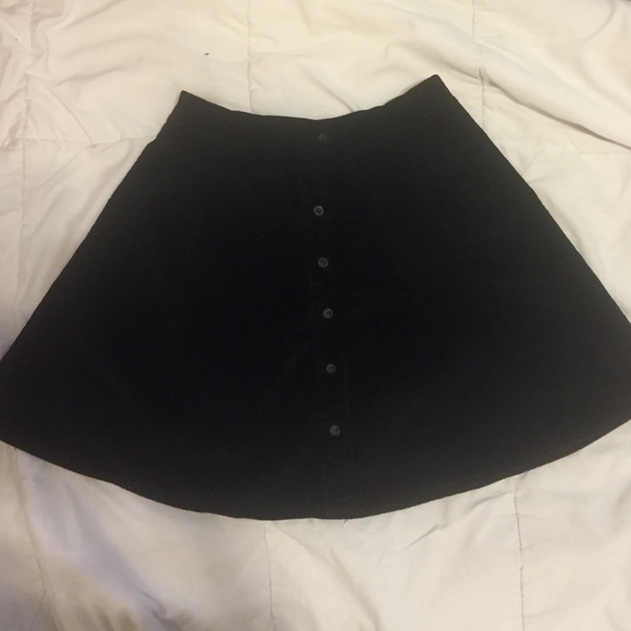 Black skirt, high waisted, flowy at the bottom