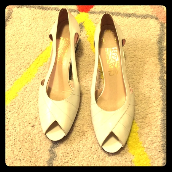 Vintage white Ferragamo open-toe pumps.