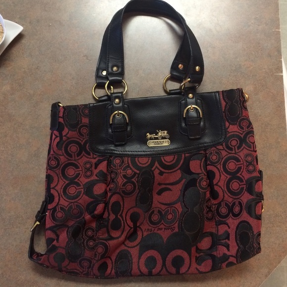 Maroon and black coach purse
