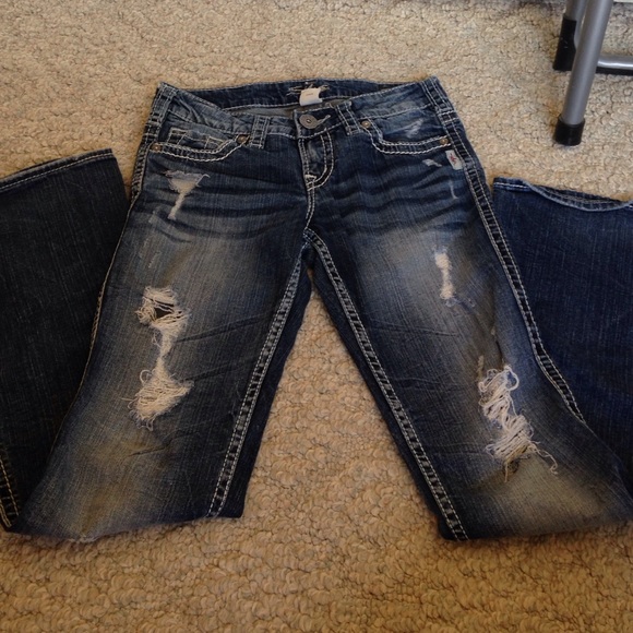 Boot cut distressed silver jeans