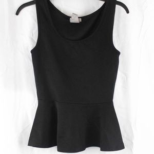 A black sleeveless blouse.