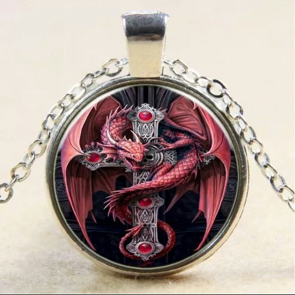 Red dragon wrapped around a cross necklace