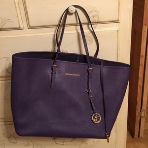 Large Michael Kors jet set title in purple