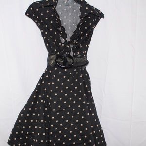 Sleeveless polka dot dress.