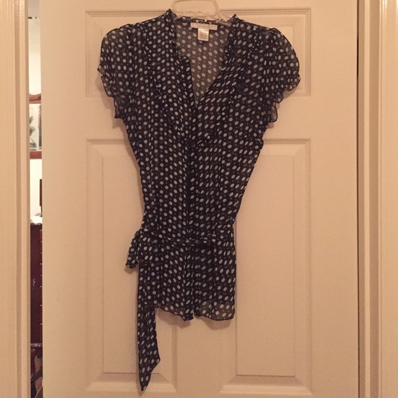 Sheer navy polka dotted blouse.