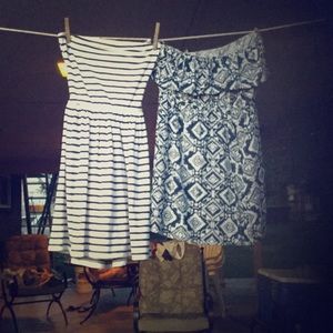 2 white and navy blue strapless dresses