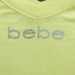 Yellow Bebe shirt with rhinestones