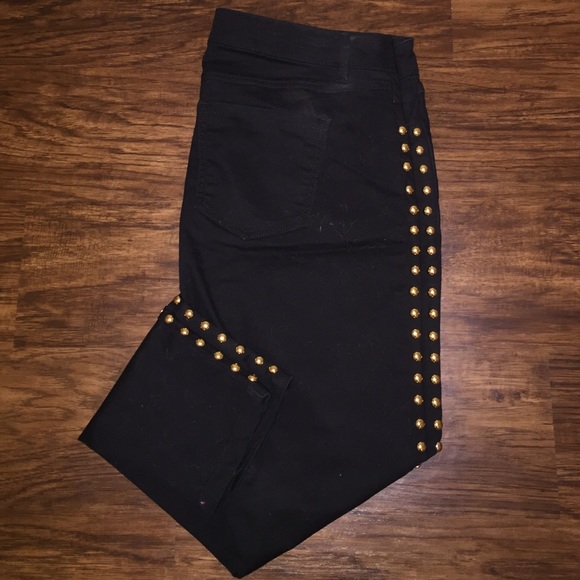 Black skinny jeans with gold buttons