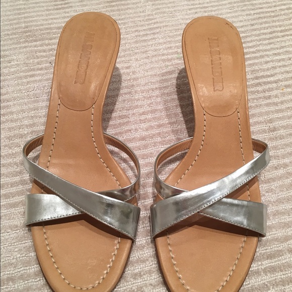 Jil Sander silver metallic slides.