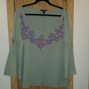 Pretty long bell sleeve igigi shirt.