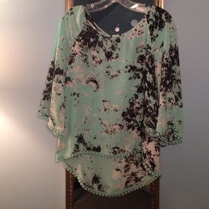 Floral mint blue with white and black details.