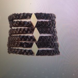 Black leather bracelet with gold studs