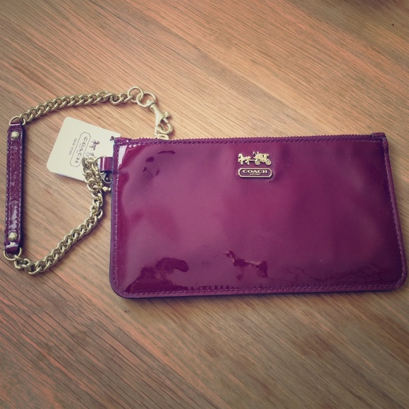 Crimson patent leather Coach wristlet.