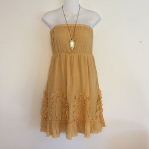 Yellow, strapless dress.