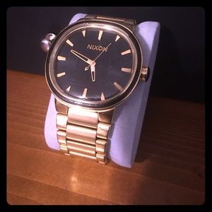 Gold Nixon "The Capital" Watch.