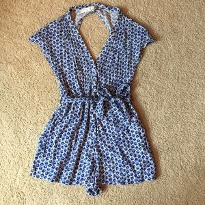 Blue and white patterned, open-back romper