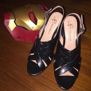 B. Makowsky Black Leather Woven Heel Sandals.