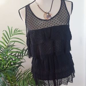 Ruffled and layered sleeveless black top. Size M