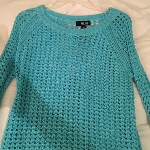 A. N. A blue sweater