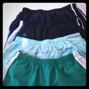 Four pairs of Nike work out shorts