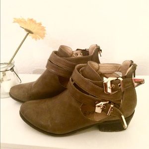 Tan ankle bootie with gold accents