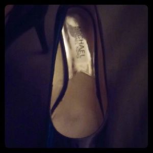 Micheal Kors black patent leather heals.