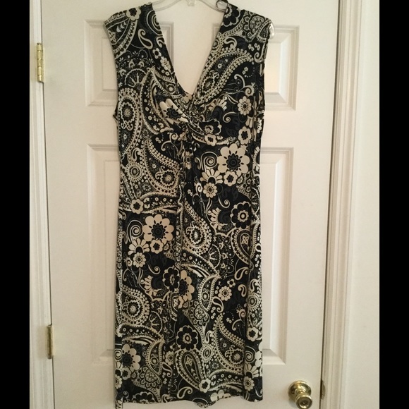 Sleeveless dress with ruching at bust.
