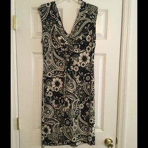 Sleeveless dress with ruching at bust.