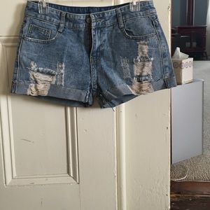 Low rise, light wash distressed jean shorts