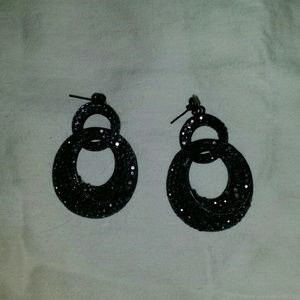 Black rhinestone on black metal pierced earrings.