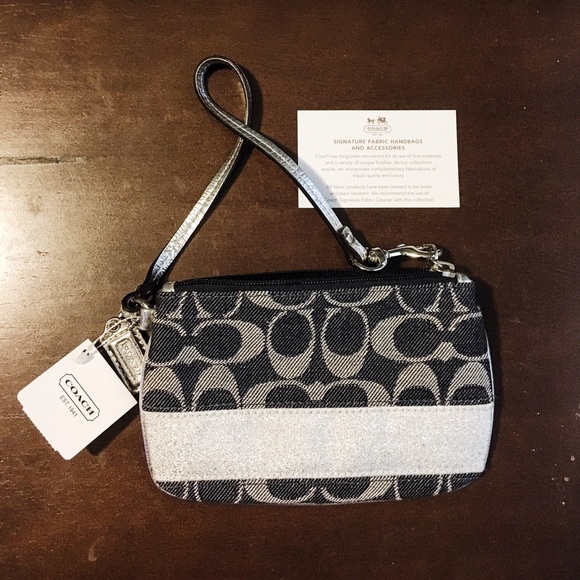 Authentic Coach wrist wallet with tags.