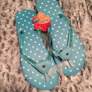 Blue polka dot flip flops