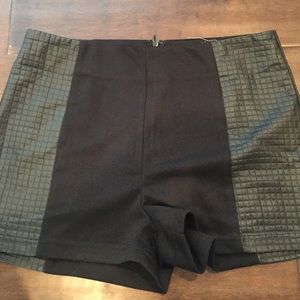 Black shorts with leather fabric on the side