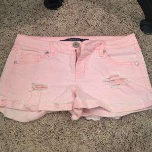 Pink distressed shorts
