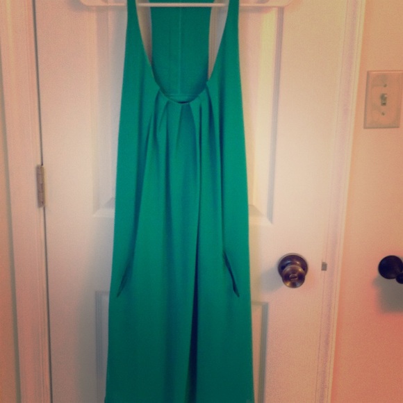 Green dress w design on back. Medium. Never worn