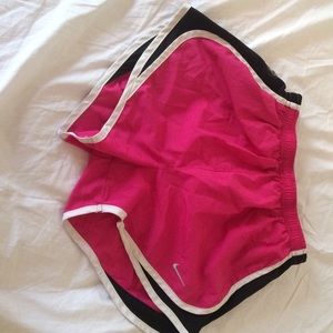 Pink and black Nike shorts