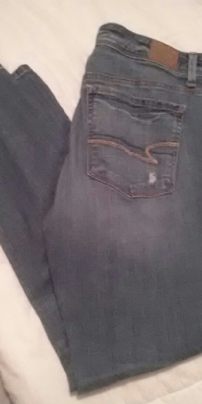 Worn Denim ripped blue jeans