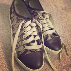 Michael Kors Logo canvas sneakers.