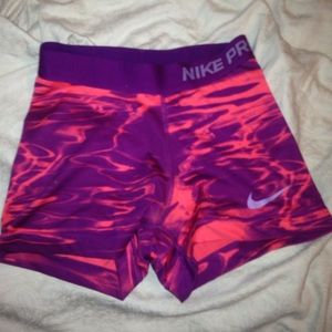 Pink and purple Nike pros