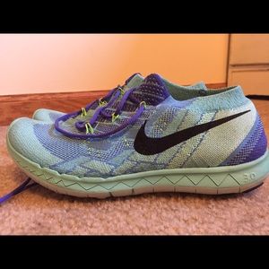 Women's Size 7 Nike Free 3.0 shoes.