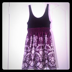 Purple and white patterned and black tunic